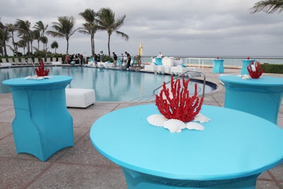 The event team quickly changed the Pedis by the Pool decor to bright blue and deep coral for the evening cocktail party.