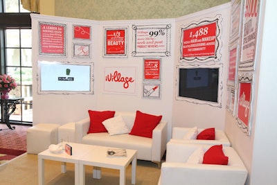 iVillage set up a red and white living room set with facts about the company on the walls.