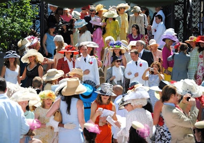 The flock descending the stairs is quite the scene at the 28th annual hat luncheon. Let the preening begin!