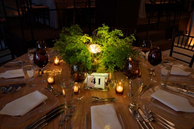 Some dinner tables were made of wood, and bare light bulbs illuminated centerpieces.