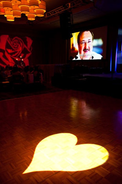 A heart-shaped spotlight illuminated the floor during the memorial tribute presentation.