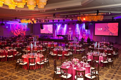 The Westin Copley Place's America ballroom was illuminated in warm tones, with two large screens on either side of the stage showing red rose projections before the ball.