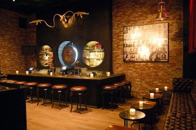Mug shots deck exposed brick walls, and a giant antelope head has machine guns for antlers