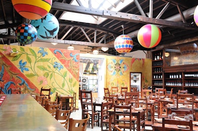 After closing for a year, Macello reopened in the West Loop in January. The colorful venue offers group salad-and-pizza dinners.