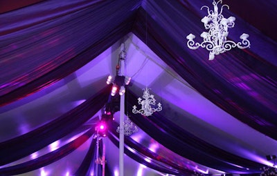 The main tent, which hosted the dinner and dancing, featured chandeliers and purple floor-to-ceiling drapes.