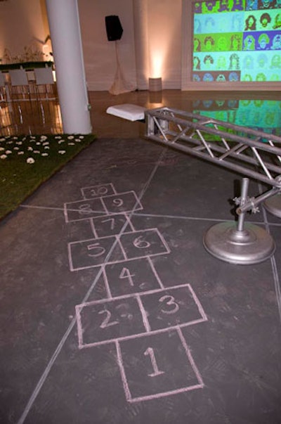 Event designers used chalk to create a hopscotch court, which helped to underscore the playful theme.