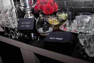 Top sponsors got lounge seating for the concert. The seating areas offered overstuffed white couches and tables piled with Crystal Head vodka, skull-shaped shot glasses, bottles of champagne, and vases of dark red roses.