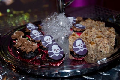 For the dessert reception, Wolfgang Puck Catering prepared a buffet of Rice Krispy treats and mini chocolate cupcakes decorated with skulls and crossbones.