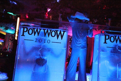 Stiltwalkers poured cocktails into guests glasses through two large ice luges with a centralized spout.