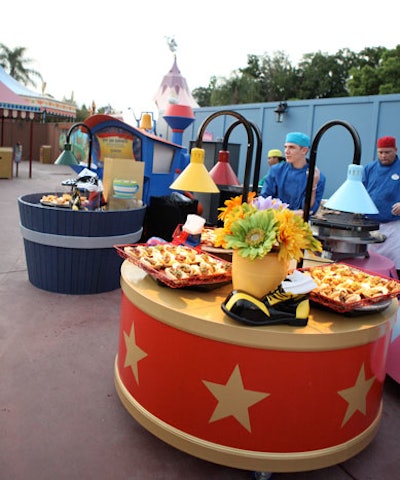 The food stations by the carousel resembled large washtubs and colorful drums topped with vibrant floral arrangements.
