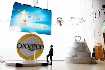 Next to the podium where Oxygen executives delivered their presentation, producers placed a 12- by-8-foot wedding cake as an homage to the network's bridal programming.