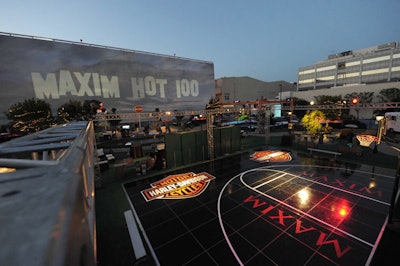 Logos for Maxim and sponsor Harley-Davidson branded a basketball half court.