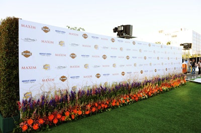 Live flowers and Astroturf decorated a 90-foot-long arrivals area.