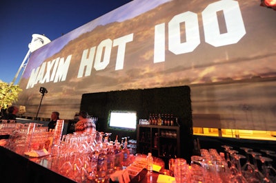 A projection in the style of the Hollywood sign announced the Maxim Hot 100 party.