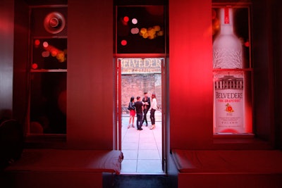 Pink lighting, gobos, and images of the bottle branded the space.