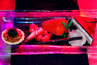 The dessert trio consisted of dark and white chocolate mousse cake, a dulce de leche tart, and rum-marinated strawberries.