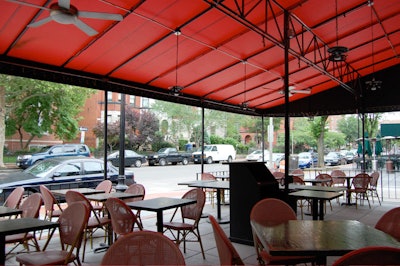 The covered patio seats 34 streetside.