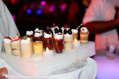 Waiters served a variety of cake and mousse shooters at the dessert party.