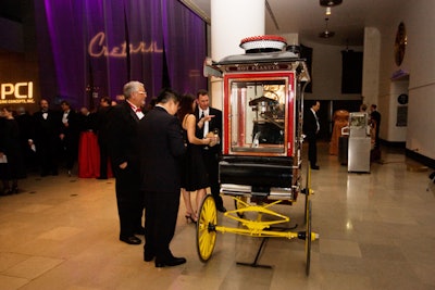 Pulled from C. Cretors in-house museum, 12 antique popcorn machines were on display. The machines were as large as 12- by 20-foot, and carefully transporting them into the space required assistance from the Museum of Science and Industry's collections department.