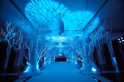 Plush white carpets and white birch trees helped to transform the embassy lobby into a winter landscape.