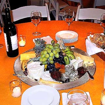 The Cleaver Company used plates of cheese and fruit as pretty, edible centerpieces at More magazine's event at the Puck Building.