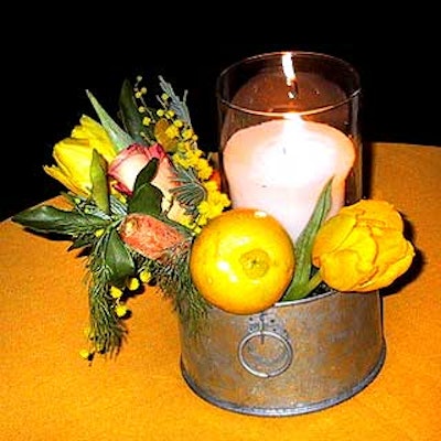 Floral designer Pierre Haibl put out small flower arrangements and candles placed in metal tins on the cocktail tables.