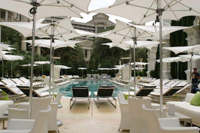 White umbrellas and seating create a clean, summery look.