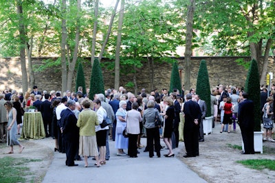 Guests mingled during a cocktail reception, held on the grounds just inside the historic asylum wall, which once enclosed the Centre for Addiction and Mental Health.