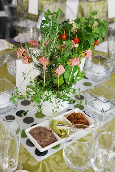 Edible centrepieces featured potted herbs and a selection of hors d'oeuvres, including skewered salami and pickles.