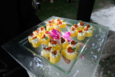 Presidential Gourmet Fine Catering used flowers to accent trays of hors d'oeuvres.