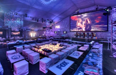 Logos filled the tent, dotting pillows and tabletops in seating groups.