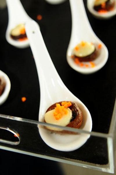 Aaron's Catering served mushroom caps filled with seasoned beef, chopped dates, cumin, paprika, and cinnamon among a selection of five passed hors d'oeuvres.