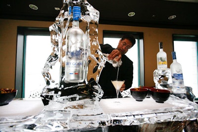 Servers poured Grey Goose vodka martinis from behind a bar by Nadeau's Ice Sculptures.