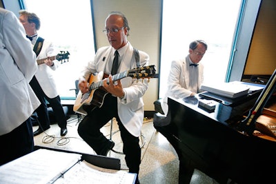 The Simone Vitale Band provided entertainment during the cocktail reception. After dinner, they moved to a tent on the lakeside terrace, where guests danced to party hits like 'Billie Jean.'