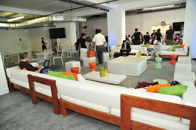 Ronen Bar and Furniture Rental provided long white couches and ottomans for the lounge area.
