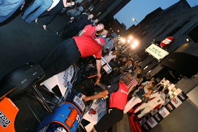 Team members positioned the Izod two-seat IndyCar in front of Rumor nightclub.