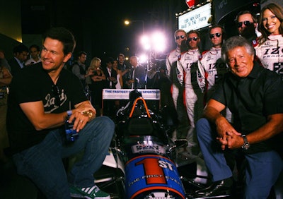 Mark Wahlberg and Mario Andretti posed in front of the Izod's IndyCar alongside drivers.