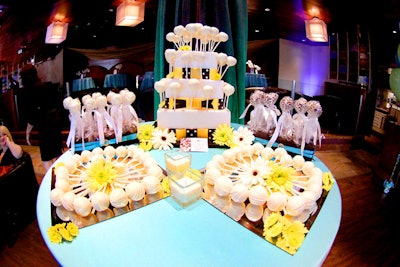 Cake O Licious provided a white wedding-style cake adorned with its signature cake pops.