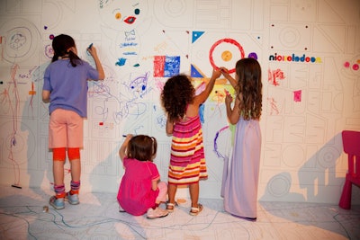 Areas of the party were decorated with coloring-book-style outlines so children could color on the walls and floors.