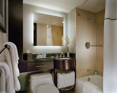 Guest bathrooms were updated with granite counters, Kohler fixtures, and pocket doors.