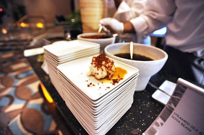 Hakkasan served steamed sea bass topped with soya bean at its food station on Friday night.