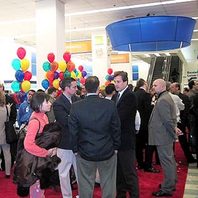 The first floor of Kmart's Astor Place store was decorated with colorful balloons and red carpet. The company's ubiquitous blue light hung in the background.