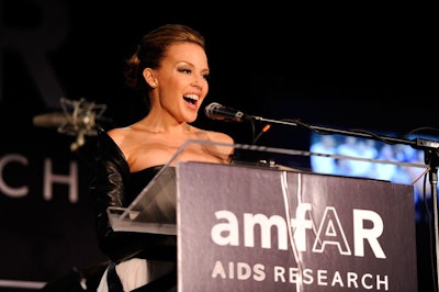 Singer Kylie Minogue signed on early to serve as M.C. of the inaugural year's parties and is committed to hosting in New York, Paris, and possibly Los Angeles.