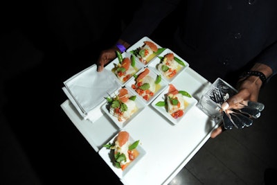 Small tasting plates from Restaurant Associates replaced last year's buffet menu. The caterer passed hors d'oeuvres like mini lobster rolls and Parmesan risotto cakes on white or silver trays, that echoed the clean decor scheme.