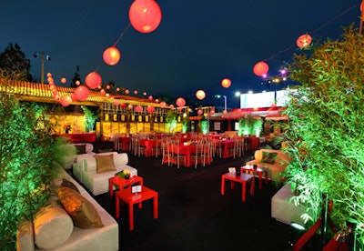 Red lanterns hung overhead in the outdoor party space.