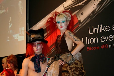 Many of the exhibitors used models with theatrical hair and makeup to draw attention to their booths.