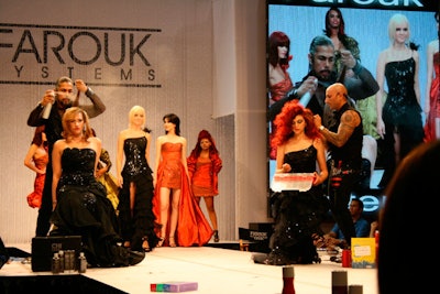 On Sunday the Farouk Systems Group exhibit featured loud music, runway models, and creative artists Leonel Rodriquez and Rocky Vitelli demonstrating hair sculpting techniques using Farouk's CHI tools.