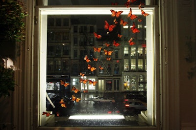 Silk butterflies accented one of the windows, giving guests a view of the rain-soaked streets outside.
