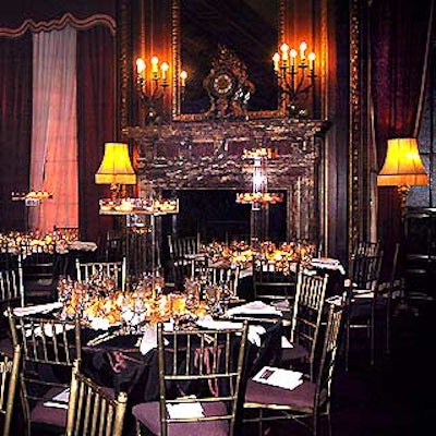 In the dining area, event designer Antony Todd draped tables with deep wine-colored taffeta cloths, and used multi-tiered Lucite boxes for centerpieces.