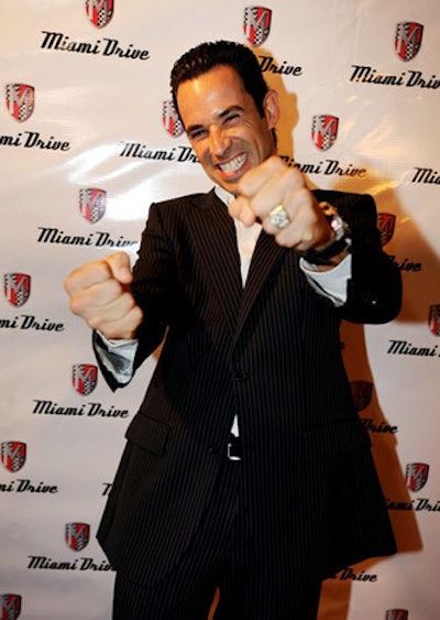 Race car driver and spokesman Helio Castroneves posed for photos and mingled with guests.